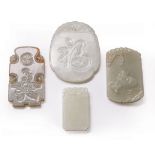 Four Chinese Celadon Jade Plaques or Pendants , incl. rounded rectangular-form carved with a boy and
