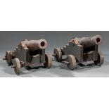 Pair of Decorative Cast Iron and Wood Cannons , 20th c., working wheels, tube l. 16 in., overall