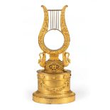 Empire Gilt Bronze Watch Holder , early 19th c., harp form flanked by swans, oval base, h. 10 1/2