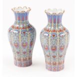 Decorative Pair of Chinese Polychrome Porcelain Fluted Vases , decorated with stylized bats and