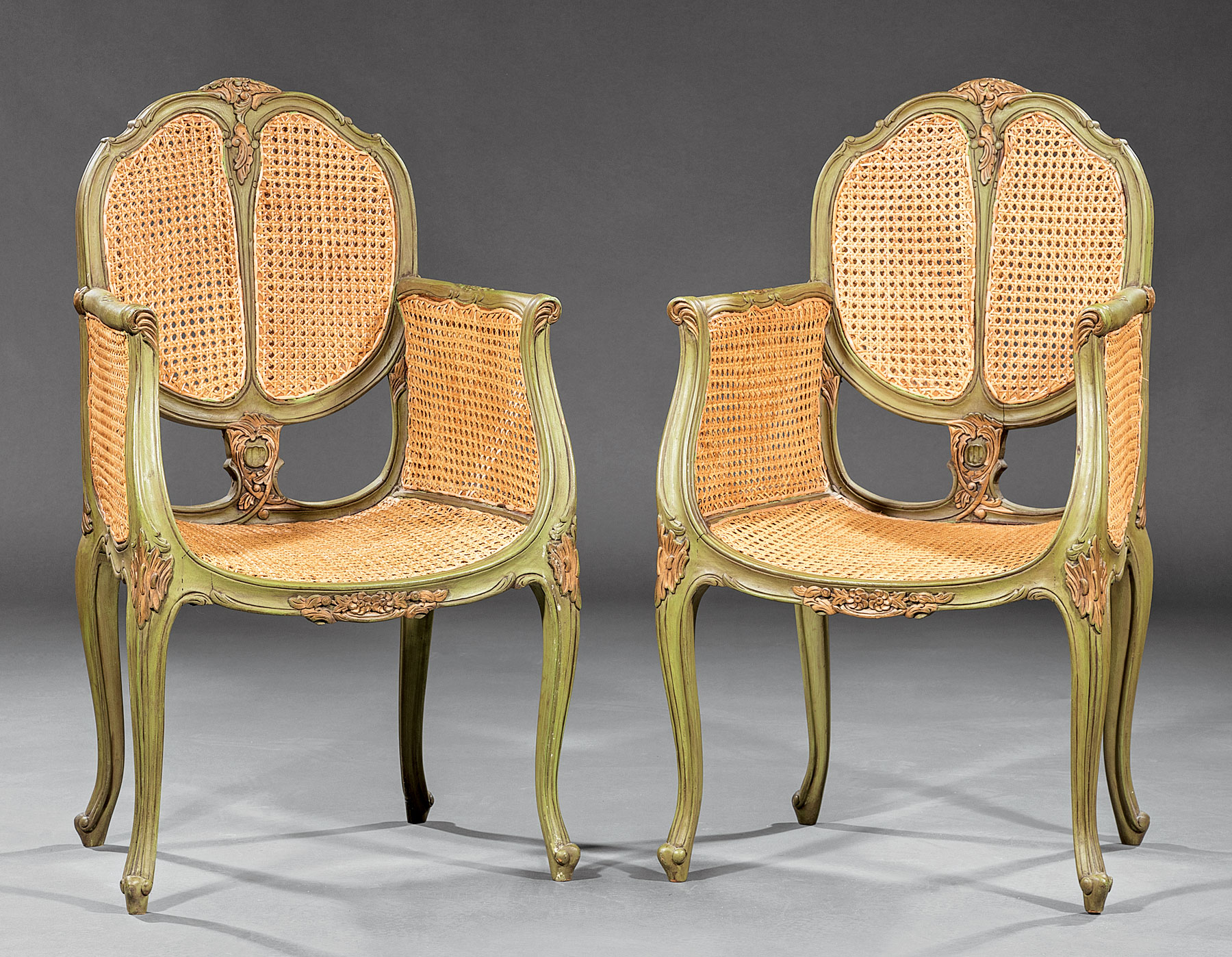 Pair of Vintage Continental Painted and Caned Bergeres , cartouche back, foliate decoration,