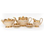Fine Paris Gilt-Decorated Porcelain Tea Service , 19th c., reeded bodies, incl. teapot, h. 6 in., w.
