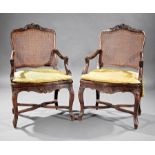 Pair of Antique Provincial Louis XV Carved Walnut Fauteuils , 18th c., diapered shell and scroll