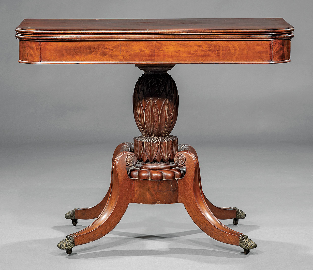 American Classical Mahogany Games Table , early 19th c., foldover swivel top, pineapple-carved - Image 2 of 2