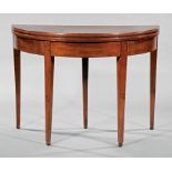 Louis XVI-Style Mahogany Demilune Games Table , foldover top, tapered legs ending in wooden ball