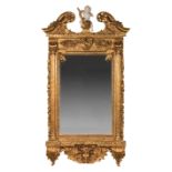 Pair of Italian Rococo-Style Carved and Gilded Mirrors , broken-arch cornice centered by a composite