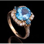 14 kt. White Gold, Blue Topaz and Diamond Ring , central round topaz flanked by 2 smaller stones,