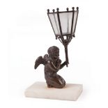 Continental Patinated Bronze Figural Candleholder , modeled as a winged putto, marble base, h. 9 in