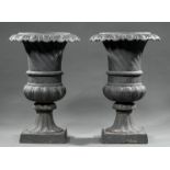 Pair of American Cast Iron Garden Urns , egg-and-dart molded collar, lobed body, square plinth base,