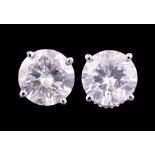 Pair of 18 kt. White Gold and Diamond Stud Earrings , two prong set round brilliant cut diamonds,