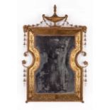 Antique Adam-Style Reverse-Painted and Giltwood Mirror , surmounted by an urn crest, ram's head