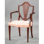 Antique George III-Style Carved Mahogany Armchair , shield back, shaped arms, tapered legs, spade