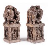 Pair of Chinese Soapstone Seals , each carved as an old elephant with two boys clambering up and