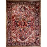 Antique Persian Carpet , red ground, blue border, central medallion, overall stylized floral design,