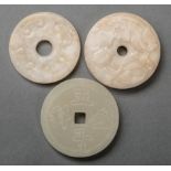 Three Archaistic Chinese Jade Bi Disks , incl. 2 of creamy white and russet stone, dia. 2 1/4 in.