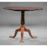 American Federal Carved Mahogany Tilt-Top Table , late 18th c., turned standard, tripod base, pad