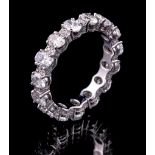 18 kt. White Gold and Diamond Eternity Band Ring , incl. 15 oval cut and 15 round brilliant cut