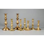 Four Pairs of English Turned Brass Candlesticks , 19th c., h. range from 6 1/8 in. to 10 1/2 in. (