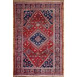 Persian Josheghan Carpet , red and blue ground, central medallion, stylized floral border, 4 ft. 4