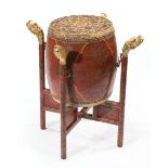 Chinese Polychrome and Gilt Decorated Red Lacquer Drum on Stand , early 20th c., drum with hide ends