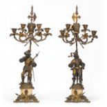 Pair of French Gilt and Patinated Bronze Four-Light Figural Candelabra , 19th c., in the Renaissance