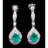 Pair of 18 kt. White Gold, Emerald and Diamond Earrings , 2 prong set emeralds with brilliant cut