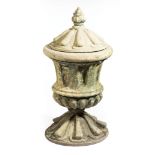 American Cast Stone Covered Urn , 19th c., flame finial, fluted body, reeded top and base, h. 43