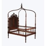 Rare American Renaissance Walnut Canopy Youth Bed, late 19th c., finialed arched canopy, broken