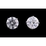 Pair of Large Platinum and Diamond Stud Earrings, 2 prong set round brilliant cut diamonds,