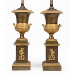 Pair of French Gilt and Patinated Bronze Medici Urns, 19th c., tall base mounted with troubadours,