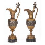 Neoclassical-Style Patinated Bronze Ewers, 20th c., putto-mounted handles, continuous relief of