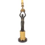 French Restauration Gilt and Patinated Bronze Figural Candlestick, c. 1830, figure holding basket,