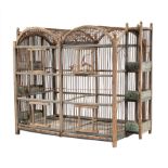 Antique Painted Wood Bird Cage, four spring-loaded doors, six feeding trays, h. 22 in., w. 30 in.,