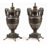 Pair of Neo-Grec Bronze Urns, early 20th c., continuous frieze of Classical figures, paw feet, now