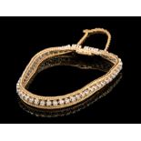 14 kt. Yellow and White Gold and Diamond Tennis Bracelet, set with 54 full-cut diamonds, total wt.