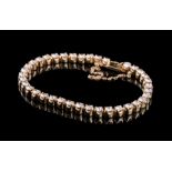 14 kt. Yellow Gold and Diamond Tennis Bracelet, 37 prong-set round brilliant cut diamonds, each