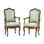 Pair of Italian Rococo Carved Fruitwood Armchairs, 18th c., serpentine foliate carved backs,