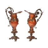 Pair of Beaux Arts Patinated Metal Ewers, c. 1900, scroll handle, mounted with Neptune mask and