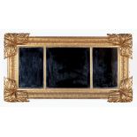 American Classical Carved Giltwood Overmantel Mirror, early 19th c., exuberant acanthus corner