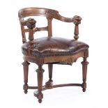 Continental Carved Mahogany Chaise de Bureau, early 20th c., incurvate back, lion head terminals,