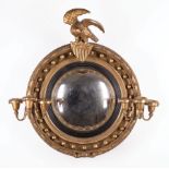 English Carved and Gilded Convex Mirror, 19th c., later eagle crest and floral candlearms,