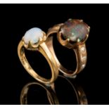 Two 14 kt. Yellow Gold and Gemstone Rings, one set with black opal and diamonds, the other with an