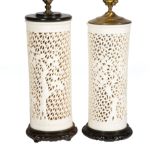 Pair of Chinese White Glazed Porcelain Wig Stands, reticulated bodies with prunus and bamboo, h.