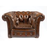 Chesterfield Leather Armchair, button tufted back and arms, loose seat cushion, nailhead trim, bun