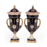 Pair of German Gilt and Cobalt Porcelain Covered Urns, 20th c., marked "Rudolstadt", peacock feather