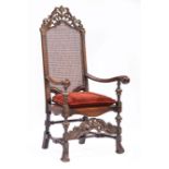 William and Mary-Style Carved Walnut and Caned Armchair, pierced urn-carved crest, fluted