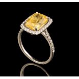 Platinum, Yellow Sapphire and Diamond Ring, central prong set modified brilliant cut sapphire, wt.