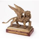 Continental Bronze Figure of the Lion of St. Mark, rouge marble base, h. 7 1/2 in., w. 9 1/2 in., d.