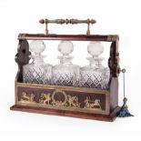 English Brass-Mounted Mahogany Tantalus, mid-19th c., cut crystal decanters, Classical frieze, h. 12
