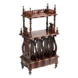 William IV Carved Rosewood Canterbury, 19th c., turned finials and supports, serpentine shelves,